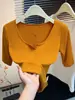 Camiseta delgada de manga tres cuartos con cuello en U grande estilo coreano para mujer, nueva y elegante para otoño 2026, top de manga media abotonado que reduce la edad