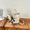 Comercio exterior bolsa de mano de lujo ligero con tacto de alta gama, bolsa tipo cubo para mujer, nuevo otoño, retro, versátil, patrón de lichi, bandolera única