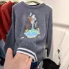 Estación Europea 2026 Otoño/Invierno Nuevo Estilo Coreano Cuello Redondo Suéter de Lana de Dibujos Animados para Mujer, Corte Holgado, Top de Punto que Reduce la Edad