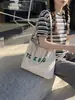 Comércio exterior por atacado moda europeia e americana letra 2026 nova bolsa de ombro retrô grande capacidade bolsa tote para trabalho e deslocamento