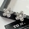 Pendientes Largos Colgantes de Flor Hueca con Pedrería de Lujo Ligeros de Moda para Mujer Pendientes Largos de Cristal Diseño de Nicho Pendiente Exagerado
