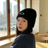 Bloguera de Corea del Sur con gorro de lana de punto con lazo otoño e invierno ins cabeza grande todo-fósforo moda protección para los oídos gorro para el frío para mujer