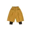 Roupas infantis Nuomi Wanzi, calças bootcut de veludo cotelê com design falso de duas peças para meninas, calças casuais compridas versáteis para o outono infantil