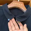 Camisa de lino azul marino para mujer, diseñador de nicho, versátil y de alta calidad, con detalles bordados en el cuello