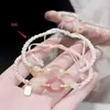 Pulsera tejida de trébol de cuatro hojas hecha a mano, regalo de la suerte de nicho para parejas y amigos, pulsera de estrella de la suerte simple y exquisita