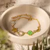Pulsera de Acero Inoxidable Chapado en Oro de 18K con Diseño de Trébol de Cuatro Hojas y Goteo de Aceite, Estilo Tranquilo y Dulce para Mujer, Joyería Transfronteriza de Lujo Ligero con un Diseño Único