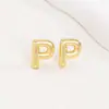 Pendientes de letras de burbuja lisas con baño de cobre y oro real transfronterizos, moda, temperamento, Joker, nuevos pendientes exquisitos, venta al por mayor
