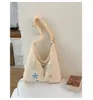 Bolsa de lona casual estilo ins coreano de grande capacidade 2026 nova fresca bordada para estudante bolsa transversal casual para mulheres