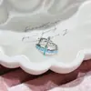 Nueva colección de serie de proteína azul de pendientes de acero de titanio médico, elegantes y versátiles, con diseños de trébol de cuatro hojas y cruz
