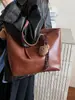 Yue Zi 2026 Otoño/Invierno Nuevo Retro para Viajes al Trabajo Gran Capacidad Alta Apariencia Elegante Bolso Tote Casual Bolso de Hombro