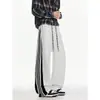 Pantalones deportivos casuales con franjas laterales para hombre, talla grande de otoño, pantalones de chándal rectos holgados de moda para estudiantes