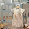 Ropa infantil coreana, vestido para niña con cuello de muñeca bordado de mariposa y flor, nuevo estilo verano 2025, vestido dulce de princesa con manga acampanada