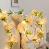 Nueva lámpara LED de alambre de cobre de ratán de flor de cerezo transfronteriza Lámpara decorativa de hoja verde para el hogar nórdico Guirnalda de luces de colores Foto Carril