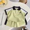 Conjunto de verano de manga corta para niños, ropa de verano nueva, POLO de bloques de color, elegante conjunto de dos piezas para niños y bebés, fresco y moderno