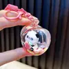 Chaveiro de panda cheio de óleo, garrafinha com areia movediça de maçã, pingente de bolsa, chaveiro de carro, prêmio de máquina de pegar, pequeno presente