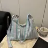 Bolso de Mujer con Rayas de Color Contrastante 2025 Nuevo Bolso de Hombro con Colgante para Viajes Diarios Estilo Coreano Lona Casual Bolso Cruzado
