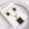Nuevo especial transfronterizo explosión de tendencia europea y americana titanio acero alta calidad color collar pendientes traje femenino joyería de concha real