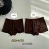 Calzoncillos Boxer Lisos de Color Invisible Sin Costuras Anti-exposición Mousse de Proteína de Cachemira Terciopelo Cintura Media Transpirable Ropa Interior Sin Costuras CM645K