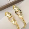 Design de personalidade europeu e americano cheetah de olhos verdes pulseira de zircônia colorida microincrustada moda sensação de alta qualidade temperamento pulseira banhada a ouro de cobre