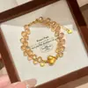 Pulseira Gota de Água Champagne Pêssego Escovado Retrô para Mulheres Moda Coração Contas da Sorte Pequeno Nicho Versátil Exquisite Joia de Mão