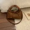 Bolso de diseñador de nicho otoño 2026 nuevo bolso de hombro cruzado de color liso para el trabajo y los desplazamientos, bolso de axila elegante y chic