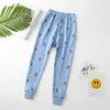 Calça térmica infantil 2026 outono e inverno, calça de dormir quentinha para meninos e meninas, material 100% algodão, calça de casa infantil estampada da moda, em estoque