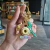 Tarjeta de dibujos animados Pibala proyección llavero aleatorio regalos para estudiantes juguetes para niños puesto máquina de garra regalos pequeños venta al por mayor