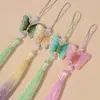 Bordado de mariposa en degradado dorado estilo nacional falda antigua con cara de caballo accesorios colgantes borla de púas hecha a mano joyería al por mayor