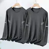 Camiseta informal de manga larga con cuello redondo, color liso, versátil, para hombre, otoño 2026, corte holgado, top moderno