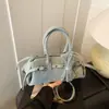 Primavera 2026 Nuevo Estilo Moda de Alta Gama Estilo Chica Popular Diseño de Hebilla Elegante Versátil Bolso de Mano Bolso de Hombro Bolso de Axila