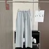 Outono de 2026 novo calça de moletom esportiva casual feminina, de cintura alta elástica, modelagem slim, com caimento drapeado, barra desfiada
