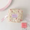 Bolsa de cosméticos con estampado de tulipanes estilo coreano, una bolsa de viaje multifuncional, una bolsa con cordón para guardar toallas sanitarias y un estuche para papelería/lápices