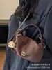 Bolsa Feminina 2025 Nova Moda Outono e Inverno High-End Retrô para o Dia a Dia Feminina Ombro Único Transversal Bolsa Bolinho