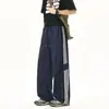 Nuevos pantalones casuales rectos de rayas laterales para hombre otoño-verano, pantalones deportivos ligeros de moda con un toque de alta gama para hombres