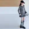 Conjunto de Falda Corta de Punto para Niñas Otoño Nuevo Estilo Versión Coreana Suéter Estilo Universitario Falda Plisada Suéter para Niña Top de Moda