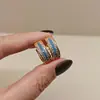 Pendientes Azules de Turquesa Simulada en Forma de U de Venta Caliente Transfronteriza para Ropa de Trabajo, Lujo Accesible, Pendientes de Moda de Alta Gama Versátiles Completos de Circonita Diamantada