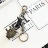 Personalidad creativa hecho a mano retro piel de vaca bronce búho llavero creativo pequeño regalo fábrica lote