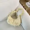 Bolsa de Ombro Transversal Versátil Moda Tendência Verão 2026 com Toque de Luxo e Design Único para o Dia a Dia Bolsa Dumpling