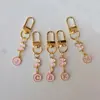 Llaveros Transfronterizos Estilo Lindo con Colgantes de Letra y Mariposa, Dijes para Bolsos, Pequeños Regalos, Productos Terminados al Por Mayor