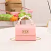 Bolsa 2023 nueva fina suave mini patrón de cocodrilo asa de cierre bolsa de gelatina pequeña fresca bolsa para lápiz labial transmisión en vivo