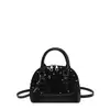 Elegante bolso de mano con concha de lentejuelas para mujer, nuevo bolso cruzado plateado de moda 2026, bolso de hombro de nicho para el día a día