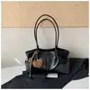 Bolsa tote de cor sólida, estilo retrô, grande capacidade, nova coleção 2026, moderna, simples e elegante, adequada para o trabalho e o trajeto, bolsa de ombro