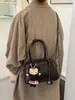 Bolsa de concha para bolos para mujer, estilo retro simple de nicho, bandolera simple, bolsa de axila, bolsa cruzada estilo viaje y desplazamiento