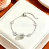 Pulsera de Acero de Titanio Delgada para Cintura con Diamantes Completos de Lujo Ligero para Mujer Nicho Lujo Ligero Color Duradero Gama Alta Celebridad de Internet Venta Caliente Joyería al por Mayor