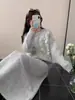 Conjunto de Dos Piezas de Cárdigan y Falda Tejidos con Flores Tridimensionales 2025 Otoño e Invierno Nuevo Estilo Coreano Traje de Suéter Holgado para Mujer