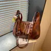 Bolsa de ombro transversal com textura de moda retrô, grande capacidade, novo design de nicho Outono/Inverno 2026, bolsa para o dia a dia, bolsa de bolinho