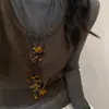 Corda de couro de ácido acético pingente de pente de leopardo colar corrente de suéter de outono feminina nicho de alta qualidade acessórios de design retrô