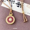 Collar Colgante de Girasol de Lujo Versátil de Gama Alta al por Mayor con Diamantes de Puntos Rojos y Verdes de la Joyería