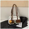 Moda transfronteriza diseño de doble bolsillo bolsa de boliche para mujer nuevo tacto de alta gama bolsa de almohada de una sola pieza bolsa de axila retro moderna