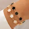Pulsera de Trébol de Cinco Hojas con Incrustaciones de Diamantes de Aleación de Moda Transfronteriza Europea y Americana Joyería Set de Tres Piezas Pulsera Geométrica Simple Lisa Venta al por Mayor